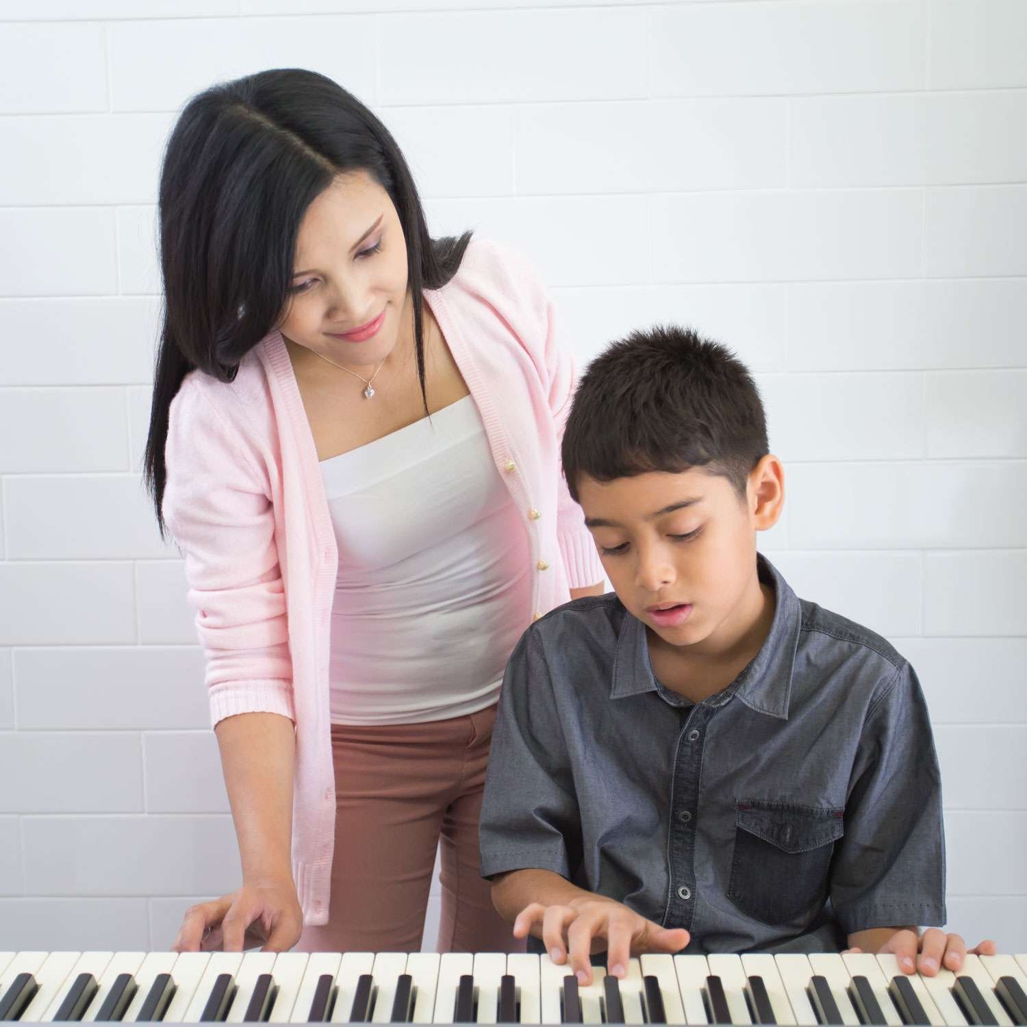 keyboard instructor and her student having a lesson