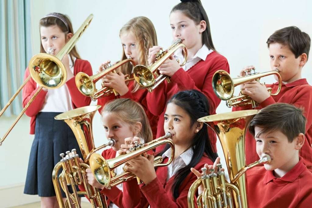 group of kids playing brass instruments