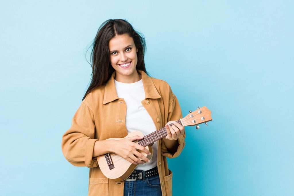 young smiling woman with ukulele